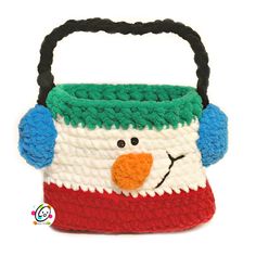 a crocheted bag with a snowman's face on the front and sides