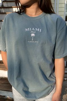 🌴 "Miami Beach Florida USA embroidered on a comfort colors tee. Designed for everyone who seeks the sun, sand, and sea, our Miami Beach T-Shirt is a unisex comfort colors tee, making it an ideal choice for both men and women. Granola Fits, Miami Bachelorette, Miami Trip, Bachelorette Tshirts, Sand And Sea, Merch Ideas, Beach T Shirt, Miami Beach Florida, Beach T Shirts