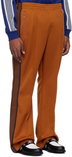 Polyester interlock jersey track pants. · Concealed drawstring at elasticized waistband · Three-pocket styling · Logo embroidered at front · Pinched seams at front · Striped knit trim at outseams Supplier color: A-rust Striped Knit, Logo Embroidered, Track Pants, Rust, Track, Trim, Luxury Fashion, Orange, ? Logo