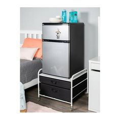 Give yourself more spots for your household supplies while saving space and adding stylish furniture to your room! This black and white fridge stand supreme will raise your mini fridge off of the floor, making it easier to access while giving you additional drawers for your supplies without taking up anymore room. Durable Steel Frame designed to hold your mini-fridge (up to 110lbs) 2 Drawers to hold cooking supplies, food, cups, plates, etc. No tools required for assembly - Includes caster wheel Txst Dorm, Dorm Room Boys, Msu Dorm, College Freshman Dorm, Small Spaces Furniture, Dorm Apartment Ideas, Decorating Dorm, Fridge Stand, Mini Fridge Stand