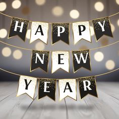 a happy new year banner with black and gold decorations