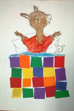 a child's drawing of a goat on top of colored blocks