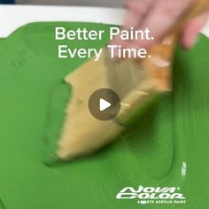 a person painting a green plate with the words, better paint every time on it