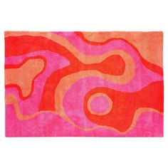 an orange and pink rug with swirls on the bottom in various colors, shapes and sizes