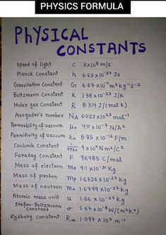 a white sign with blue writing on it that says physical constants and the formula