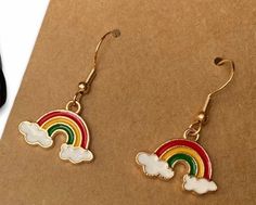 Fantastic Rainbow Earrings 925 silver ear hooks with rainbow charm The charm is alloy with enamel Rainbow Sterling Silver Jewelry, Rainbow Sterling Silver Jewelry For Pierced Ears, Nickel-free Rainbow Earrings Gift, Rainbow Nickel-free Earrings For Gifts, Nickel-free Rainbow Earrings For Gift, Charm Drop Earrings For Gifts, Rainbow Hypoallergenic Earrings As Gift, Nickel Free Enamel Dangle Earrings, Charm Dangle Earrings For Gifts