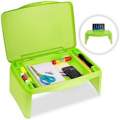 a green plastic desk with various items in it