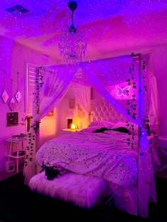 a bedroom with purple lighting and white bedding