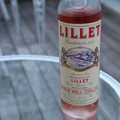 a bottle of liquor sitting on top of a glass table