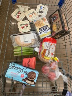 a shopping cart filled with assorted food items