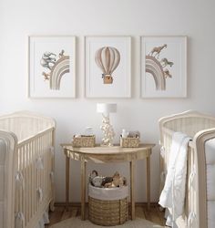 a baby's room with two cribs and three pictures on the wall