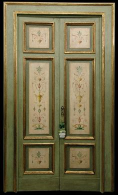 an ornately decorated double door with glass panels