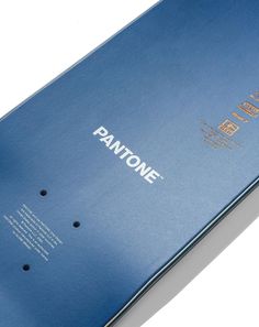 an open blue pantone book sitting on top of a table