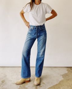 Our Ranch Jean! These are a high rise jean designed to sit on your natural waist. The leg is relaxed and leads into slight flare that hits right below your ankle. Washed for a vintage worn in look, these pair perfectly with our Ranch Boots! 100% Cotton 13 oz. denim Model is a size 25 wearing a size 25 Ranch Outfits For Women, Ranch Outfits, Ranch Boots, Farm Clothes, Work Wear Women, Denim Flares, Engineered Garments, Designer Jeans, The Ranch