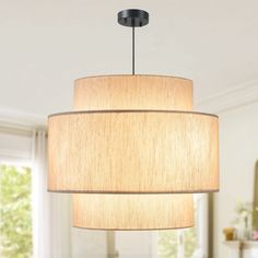 a light fixture hanging from the ceiling in a living room