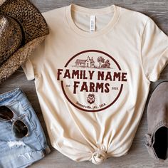 Customize this shirt with your family name, established year, and town of your home / farm. Great gift for newlywed, new home owner, farmer, chicken lover, etc... ❤️Love the design and want it in a sweatshirt? We got you covered. Tap here:  https://cottoncropshop.etsy.com/listing/1682115050/personalized-family-farm-sweatshirts SHORT SLEEVE TSHIRT FIT: ⚡️TAPERED SHOULDERS - so it retains its shape even after washing. ⚡️CREW NECKLINE adds a timeless, classic touch and a neat appearance that is per Family Farm Shirts, Family Farm Shirts Ideas, Farm T Shirt Ideas, Custom Text T-shirt For Family Gatherings, Custom Text Crew Neck Tops For Family Gatherings, Custom Text Crew Neck T-shirt For Family Gatherings, Personalized Cotton T-shirt For Family Gatherings, Funny Farm Shirts, Farm Shirts