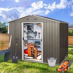 a garden shed with the door open and tools in it's storage compartment outside