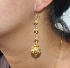 These dangle earrings feature 16mm 22 carat gold vermeil granulation beads, 6mm gold vermeil barrel beads, and gold vermeil hooks. Length is 2.25 inches. Weight is 14.75 grams. Check out our other Earrings: https://www.etsy.com/shop/KartiniStudio?section_id=16840717&ref=shopsection_leftnav_3 2 Grams Gold Ear Rings, Gold Plated Earrings With Gold Beads As A Gift, Gold Drop Earrings With Gold Beads, Gold Earrings With Beads For Celebration, Festive Drop Earrings With Gold Beads, Gold Round Earrings With Gold Beads, Gold Round Beads Earrings For Gift, Gold Beaded Round Earrings As Gift, Round Gold Beads Earrings For Gift