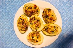 an image of some food on a plate with blue tablecloths in the background