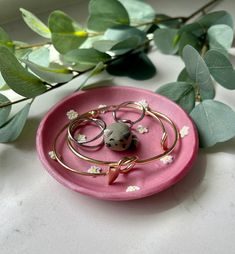 a pink plate with some rings on it