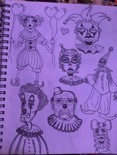 a notebook with drawings of clowns on it