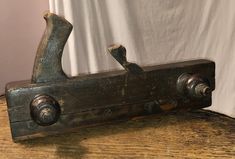 an old wooden vise on a table