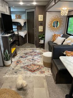 a living room filled with furniture and a flat screen tv