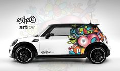 a mini car with graffiti on it's side and the words artcar above it