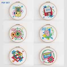 six embroidery hoop frames with different designs on them, each featuring an image of a computer