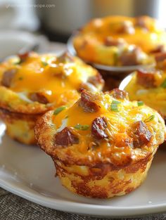 three breakfast muffins on a white plate