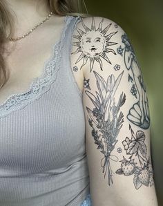 a woman with a tattoo on her arm