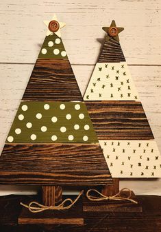 two wooden christmas trees with white polka dots on them, one is green and the other is brown