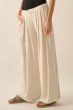 Solid linen-blend pants. Pleated front. Side-seam pockets. Waist button closure and zip-up fly. Wide leg. Elastic-back waist. Ankle length. Loose fit. 70% Rayon, 30% Linen. Imported. Designed in LA. Model wears size S. Chic Neutral Wide Leg Linen Pants, Chic Relaxed Fit Flax Bottoms, Spring Neutral Linen Wide Leg Pants, Chic Cotton Bottoms In Flax Color, Chic Cream Linen Wide Leg Pants, Chic Flax Colored Linen Bottoms, Chic Flax Linen Bottoms, Chic Neutral Linen Bottoms, Neutral Relaxed Fit High Waist Wide Leg Pants