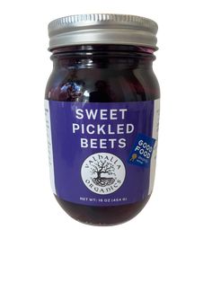 a jar of sweet pickled beets on a white background