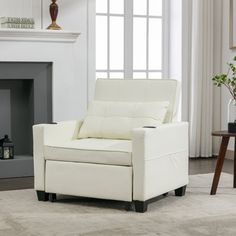 a white chair sitting in front of a fireplace