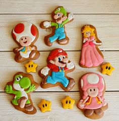 some cookies that are shaped to look like mario and princess peach, including toad prince