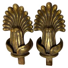 pair of antique brass sconces with peacock heads