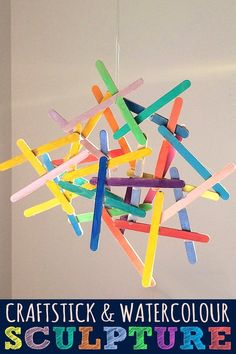 a group of sticks hanging from the ceiling with text overlay that reads craftstick and watercolour sculpture