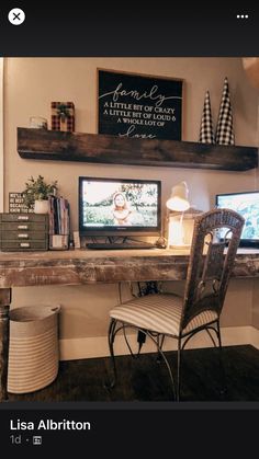 a computer desk with two monitors on top of it and a chair in front of it