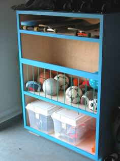 a blue shelf filled with lots of balls and bins