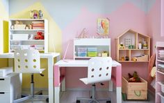 a child's desk and chair in a room with pink walls, white furniture and shelves