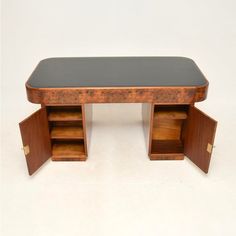 a wooden desk with two open drawers