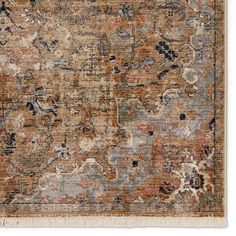 an area rug with many different colors and patterns on it, including brown, blue, beige