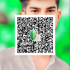 a man is holding up a qr code to show the image on his face