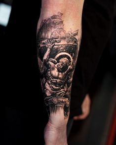 a man with a tattoo on his arm