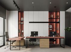 an office with two desks and bookshelves on the wall next to each other