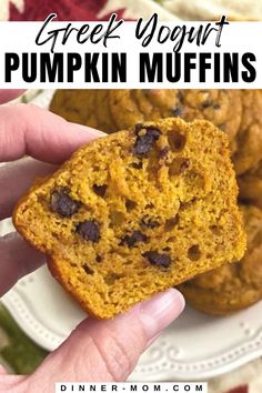 a close up of a person holding a muffin in their hand with the words, greek yogurt pumpkin muffins