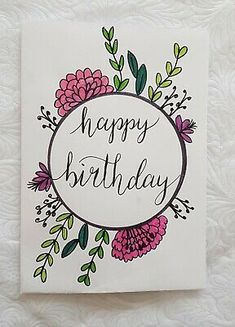 a birthday card with flowers and leaves on it