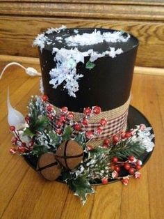 a black hat decorated with christmas decorations and snowflakes