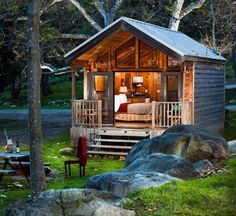 a small wooden cabin in the woods